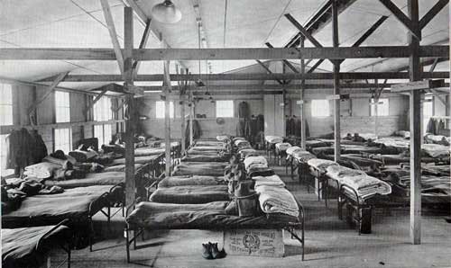 A partial view of sleeping quarters in barracks building